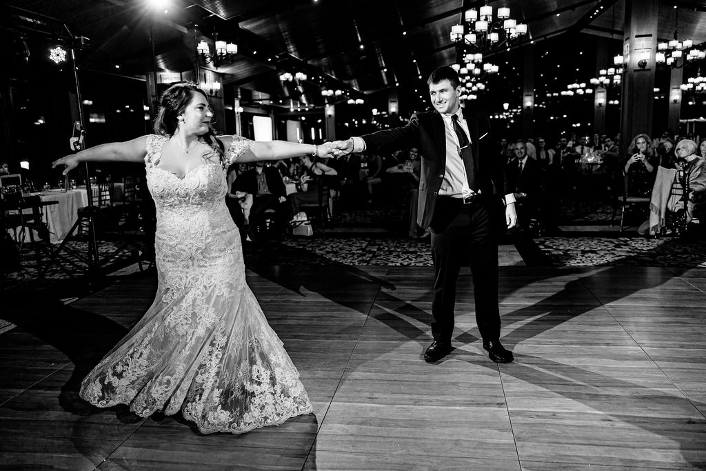 A bride and groom dance. 